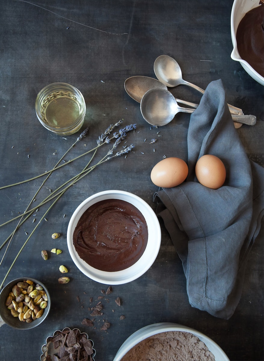 Photo by American Heritage Chocolate brown egg on white ceramic bowl beside stainless steel spoon
